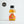 Load image into Gallery viewer, In the centre of the page is a single-serve cocktail in a cute looking small glass bottle, with a black aluminium cap. To the left of the page is a Great Taste producer logo. The cocktail is a Spiced Rum Old Fashioned and the label is orange and white. In the centre is a circle and a picture which looks like Freddie Mercury in the centre, with a red/orange background. The cocktail is a golden colour.
